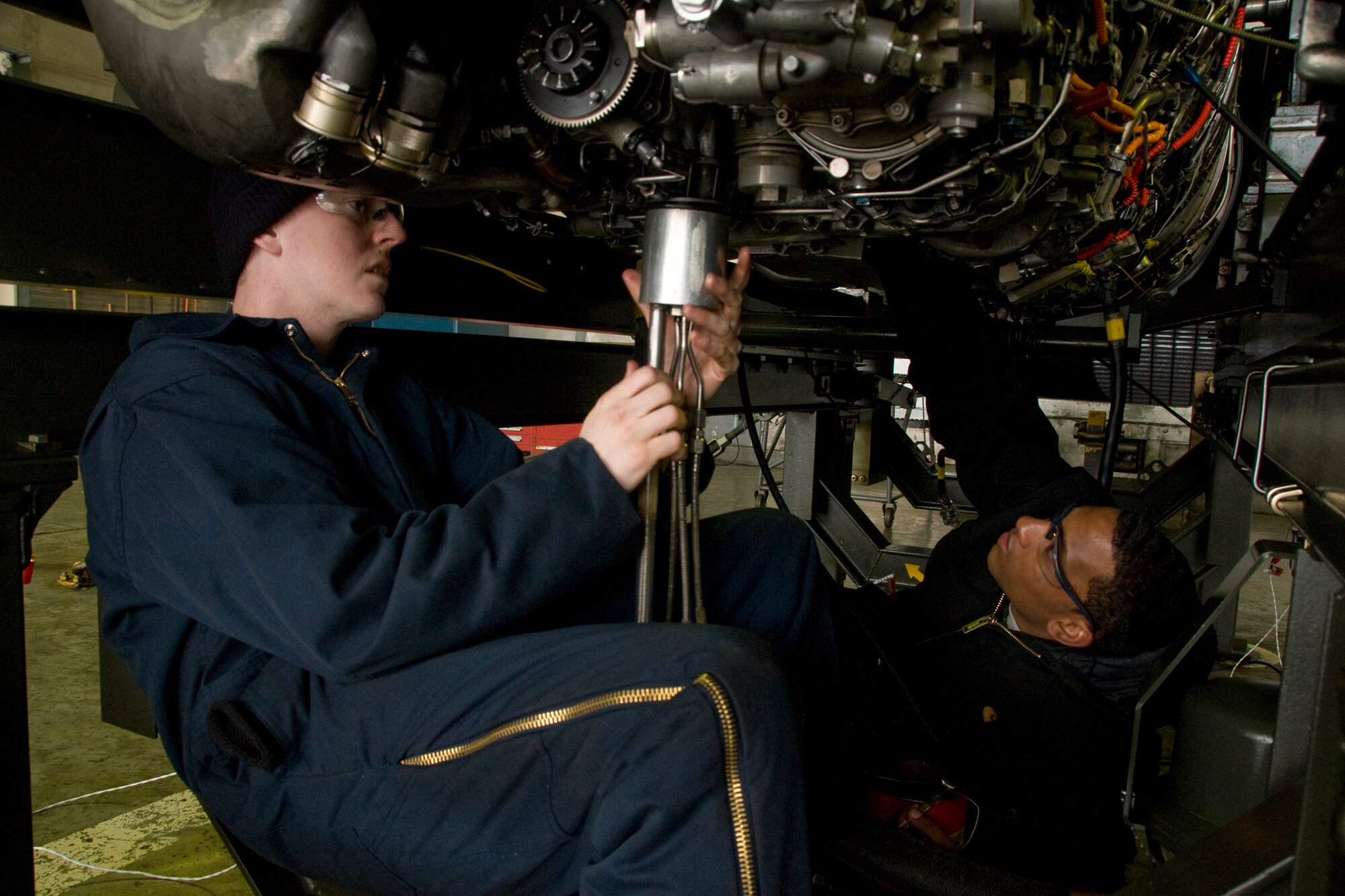 MISAWA AIR BASE, Japan -- Senior Airman Bryan Blumenkrantz and Airman 1st Class Sean Boose, both of the 35 Maintenance Squadron propulsion flight, prepare an F110-GE-129 engine for operations checks March 3, 2009. The engine was turned over to the propulsion flight due to a cracked compressor blade. (U.S. Air Force photo by Senior Airman Jamal D. Sutter)