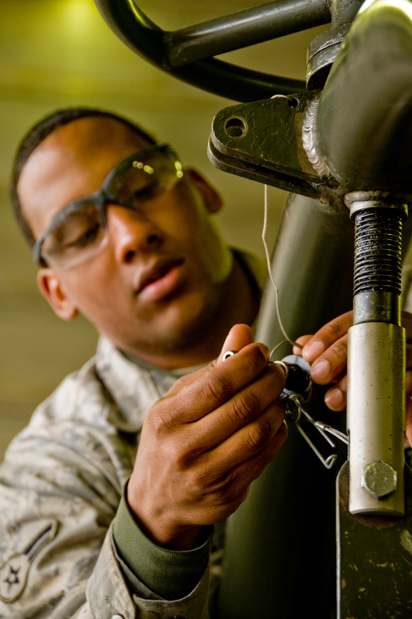 MISAWA AIR BASE, Japan -- Airman 1st Class Sean Boose, 35th Maintenance Squadron aerospace-propulsion apprentice, installs pins onto a test cell gear March 3, 2009. Airman Boose has been at Misawa for almost eight months and has worked at the test cell for about three months. (U.S. Air Force photo by Senior Airman Jamal D. Sutter)