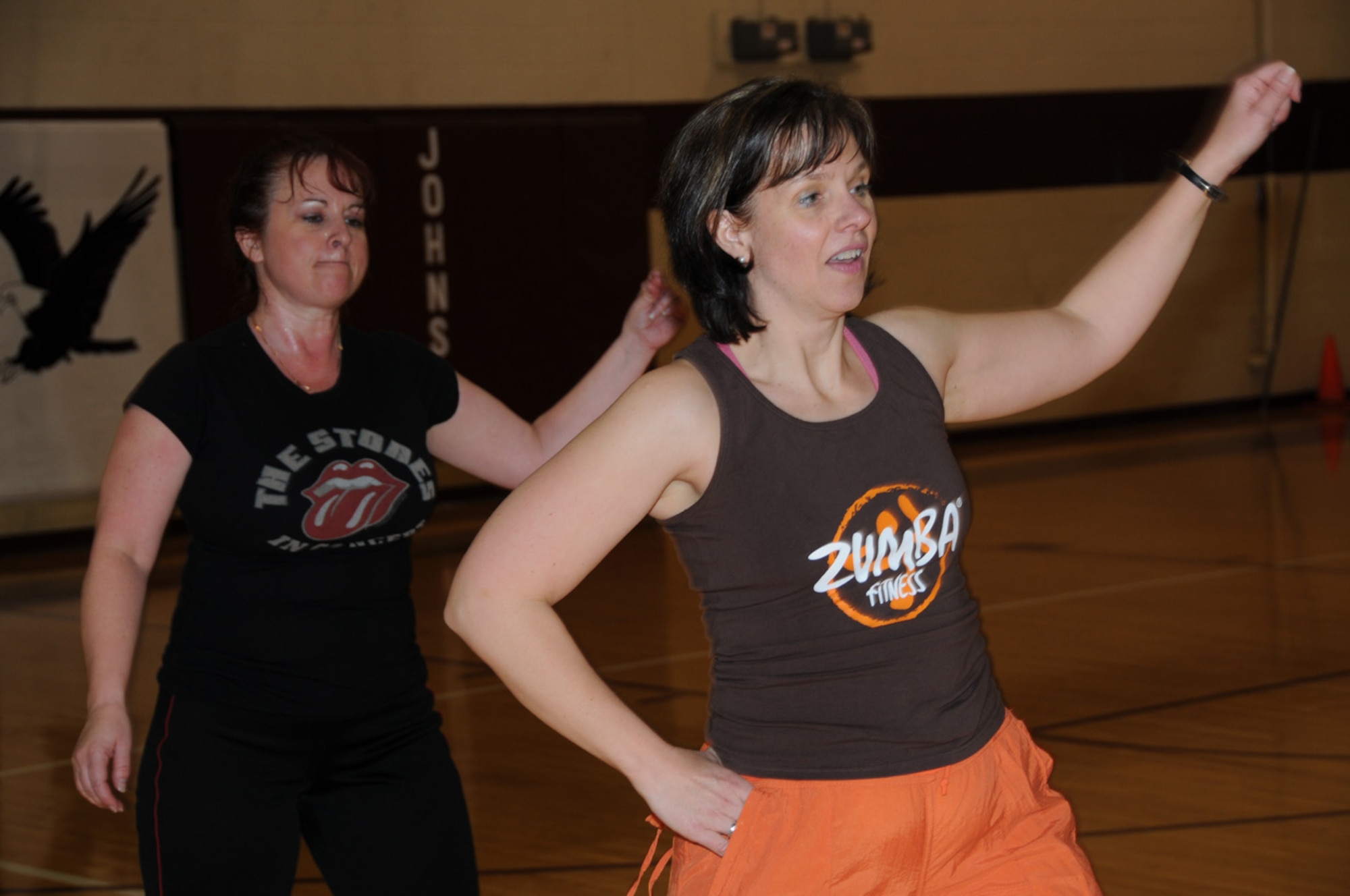 SEYMOUR JOHNSON AIR FORCE BASE, N.C. -- Maj. Carol Yeager (right), 916th Air Refueling Wing chaplain, shows Master Sgt. Jill Weissflog a Zumba move during a recent class held during the Reserve unit training assembly. Chaplain Yeager is a certified Zumba instructor and is offering classes at the base gym on drill weekends to help reservists stay fit and have fun.