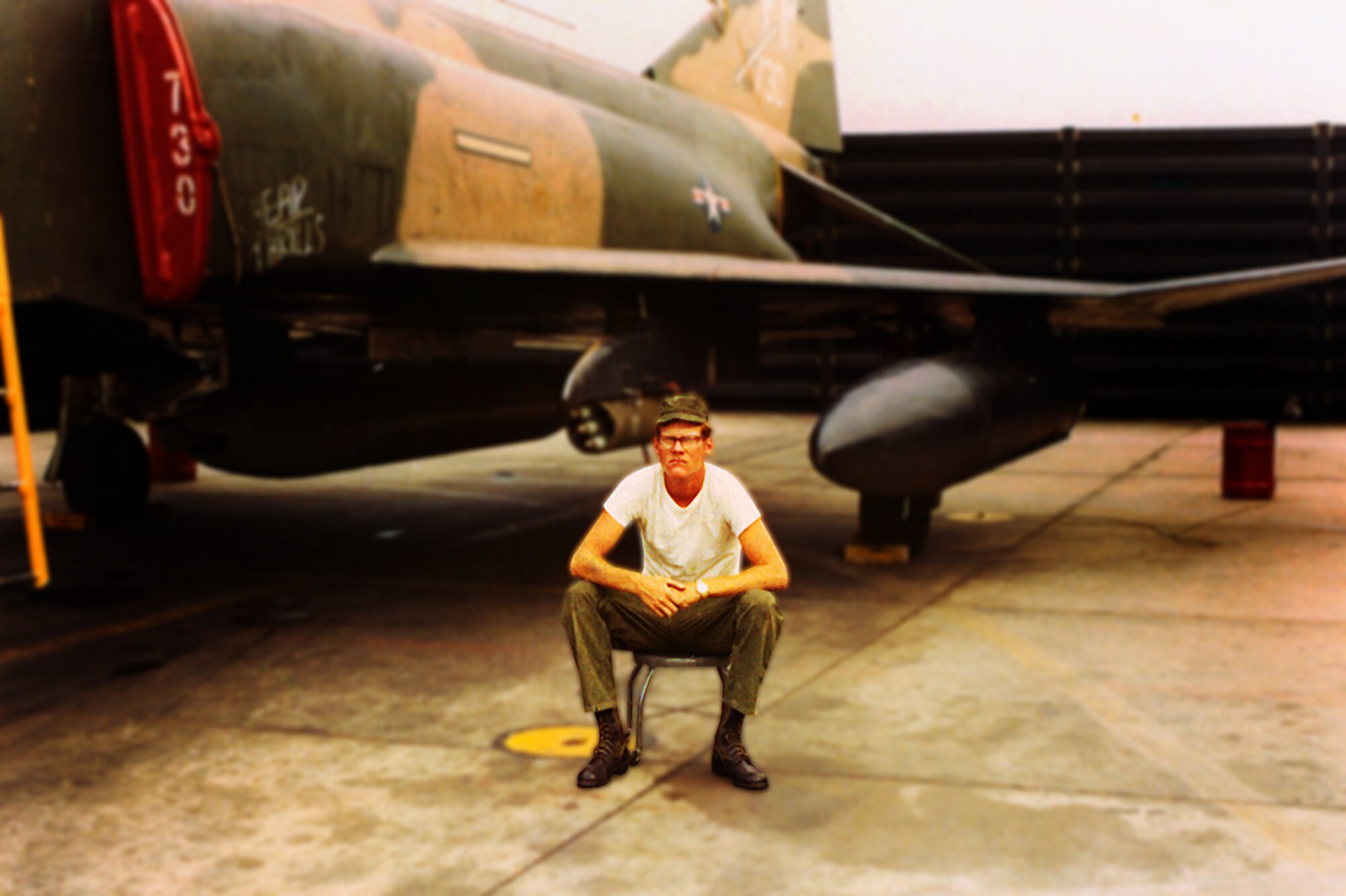 Lt. Col. Rex Meyer, deputy officer in charge of the Patrick Air Force Base command post, began his Air Force career 40 years ago. Pictured, a young Airman 1st Class on his first deployment, Colonel Meyer sits beside an F4D Phantom at Uban Air Base, Thailand. (courtesy photo)