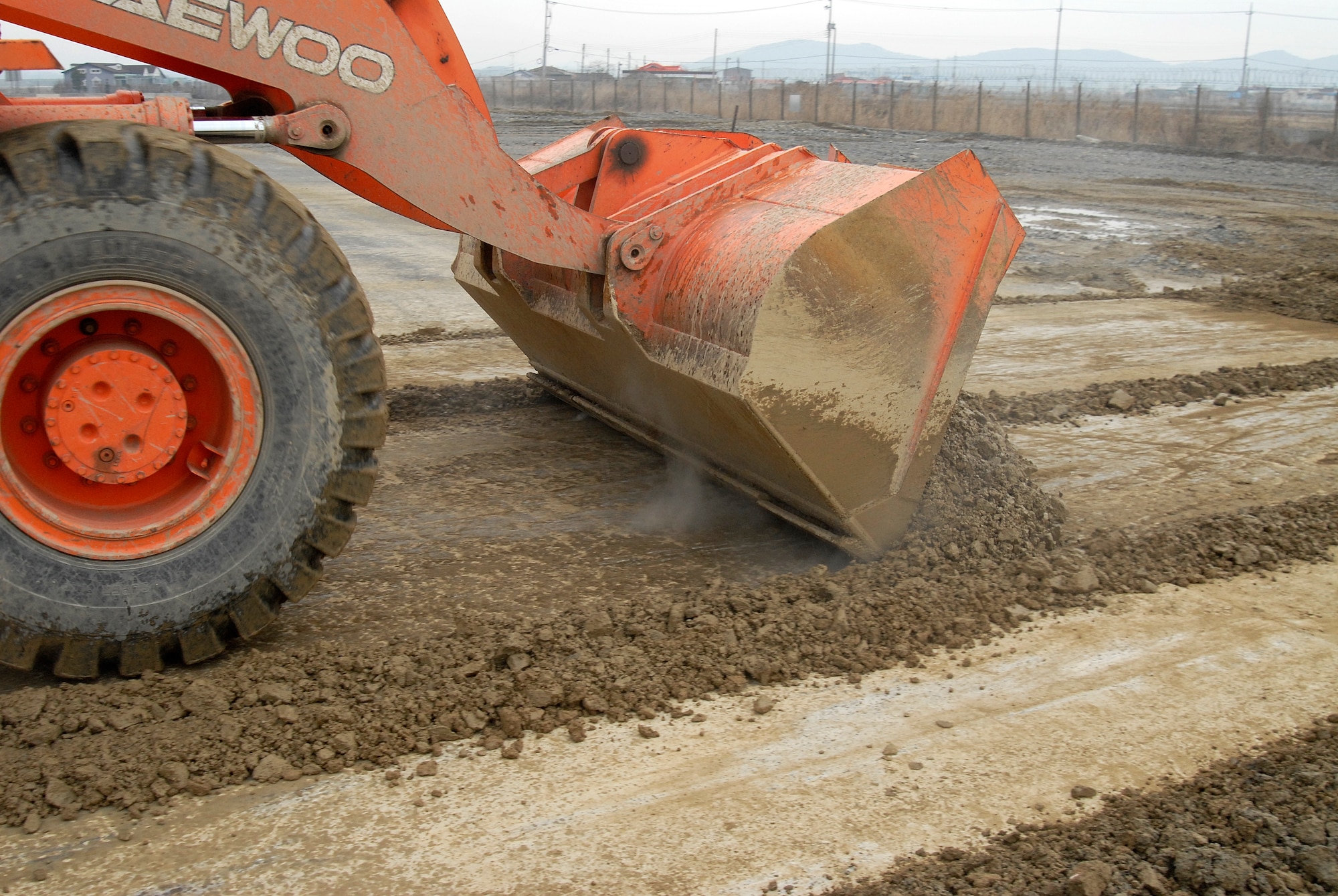 Staff Sgt. Gary Cochran, 8th Civil Engineer Squadron, clears dirt from around a crater during an Airfield Damage Repair exercise at Kunsan Air Base, Republic of Korea, March 5, 2009. ADR is a temporary fix on damage caused to the airfield by enemy fire to allow aircraft to quickly get back in the air. (U.S. Air Force Photo by SSgt Jason Colbert)