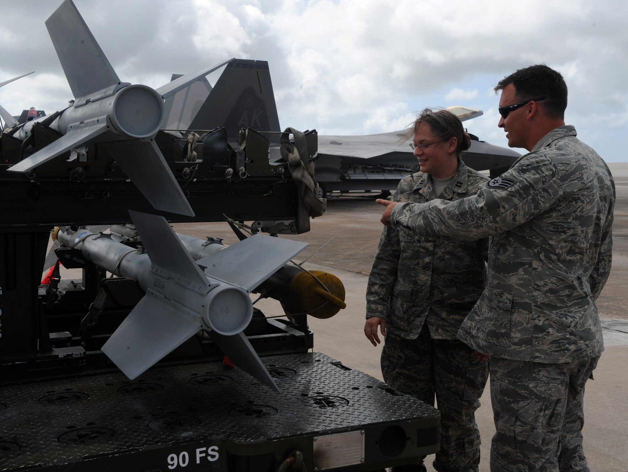 Capt. Mary Lent,  36th Expeditionary Maintenance Squadron Aircraft Maintenance Unit officer-in charge, discusses an M-9 ordnance issue with Staff Sgt. Corey Reedy, 36th EAMXS Weapons Team Chief, March 6, 2009. Captain Lent is deployed here from Elmendorf Air Force Base, Alaska, and was chosen as the 11th Air Forces Company Grade Officer of the year.(U.S. Air Force photo by Senior Airman Ryan Whitney)