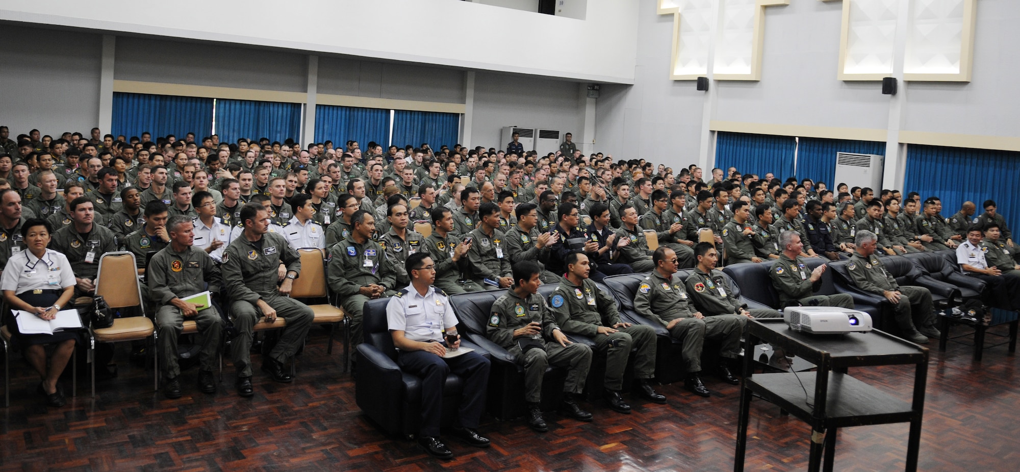 U.S., Thai and Singaporean aircrew members listen to an operations brief on March 8 at Korat Royal Thai Air Force Base in preparation for Cope Tiger 2009.  Cope Tiger is an annual, multilateral large force aerial exercise conducted in Thailand including U.S., Thai and Singaporean military forces.  The two-week exercise includes both flying and humanitarian missions conducted in Korat and Udon Thani, Thailand.  Cope Tiger 2009 kicked off March 9 and will conclude March 20. (U.S. Air Force Photo/Staff Sgt. Angelique Perez) 