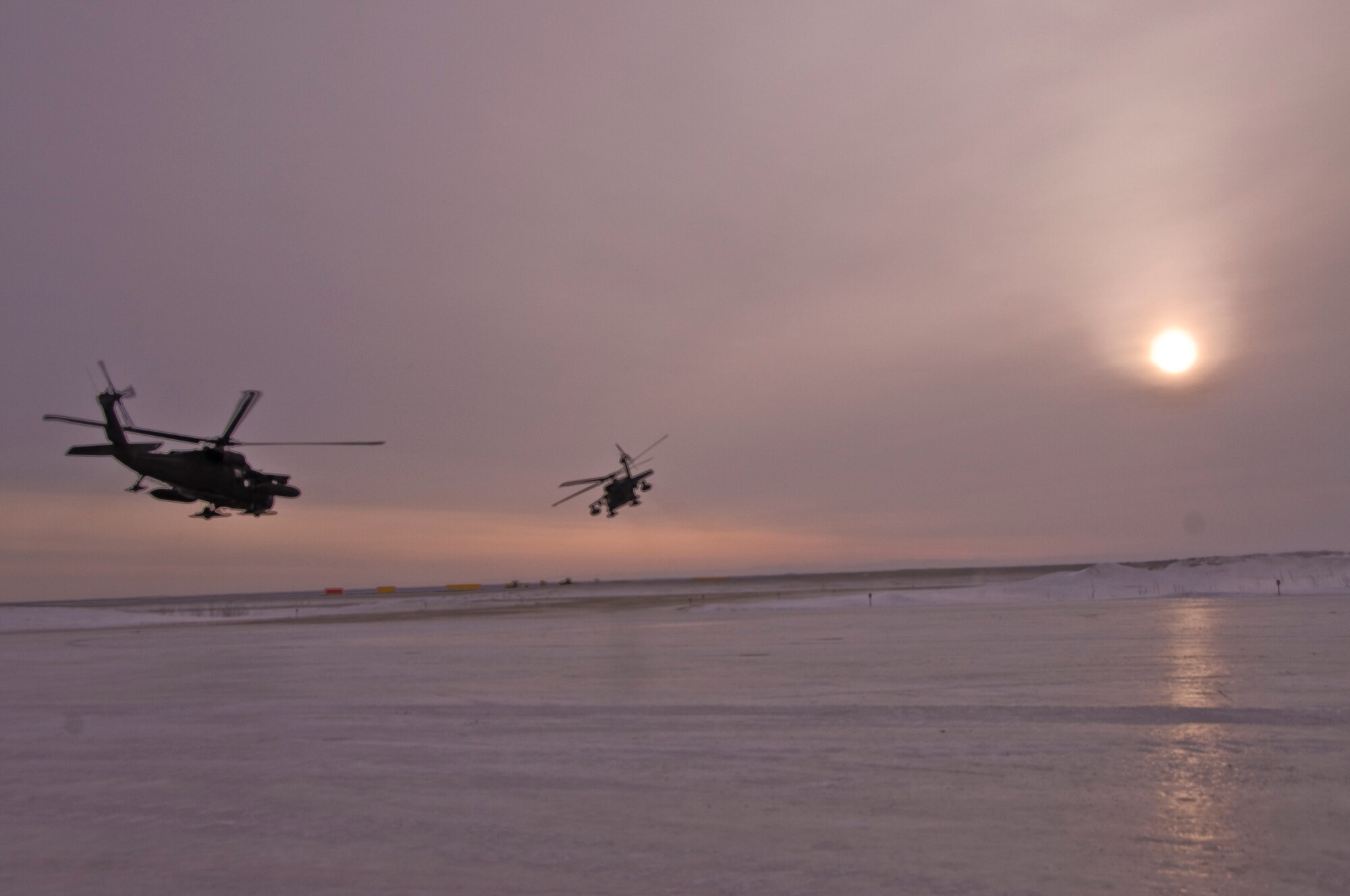 Two Black Hawks take off to transport Army Veterinary Corps teams to the villages of Alakanuk and Atmautlauk, Alaska, on March 7, 2009. Operation Arctic Care is a joint military medical readiness exercise that brings no-cost health care to underserved Alaskan residents, including dental, optometry and veterinary support. This year's Navy-led mission has teams in 11 villages in Western Alaska's Yukon-Kuskokwim Delta region. (U.S. Air Force photo by Senior Airman Christopher Griffin)