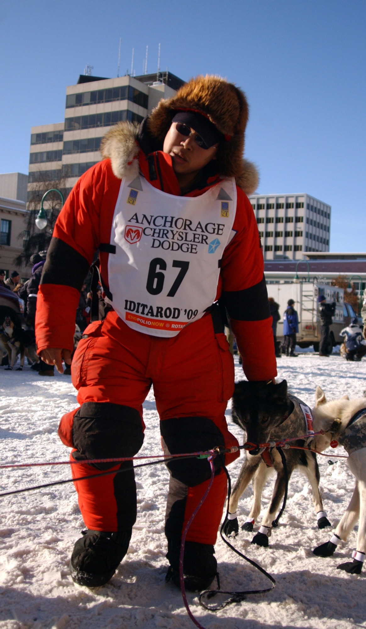 ANCHORAGE, Alaska -- Army Staff Sgt. Harry Alexie, Alaska Army National Guard, Headquarters and Headquarters Troop, 1/297th Cavalry, prepares his team to move to the starting line at the Iditarod Trail Sled Dog Race XXXVII in downtown Anchorage March 7, 2008. Alexie trained with famed Alaskan race champion Lance Mackey, and will be running 16 dogs from Mackey’s Comeback Kennel. (U.S. Army photo/Spc. Paizley Ramsey)