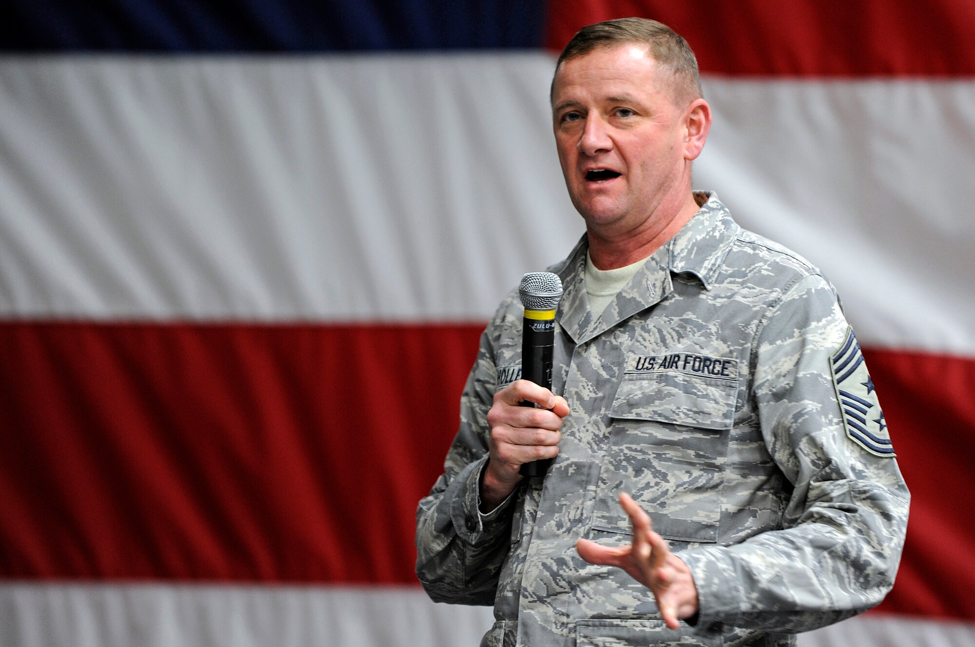 Twelfth Air Force Chief Master Sgt. Lloyd Hollen addresses Ellsworth personnel during an Airman's Call on March 5. Chief Hollen discussed the health, welfare, morale and effective utilization of enlisted personnel. (U.S. Air Force photo/Senior Airman Marc I. Lane)