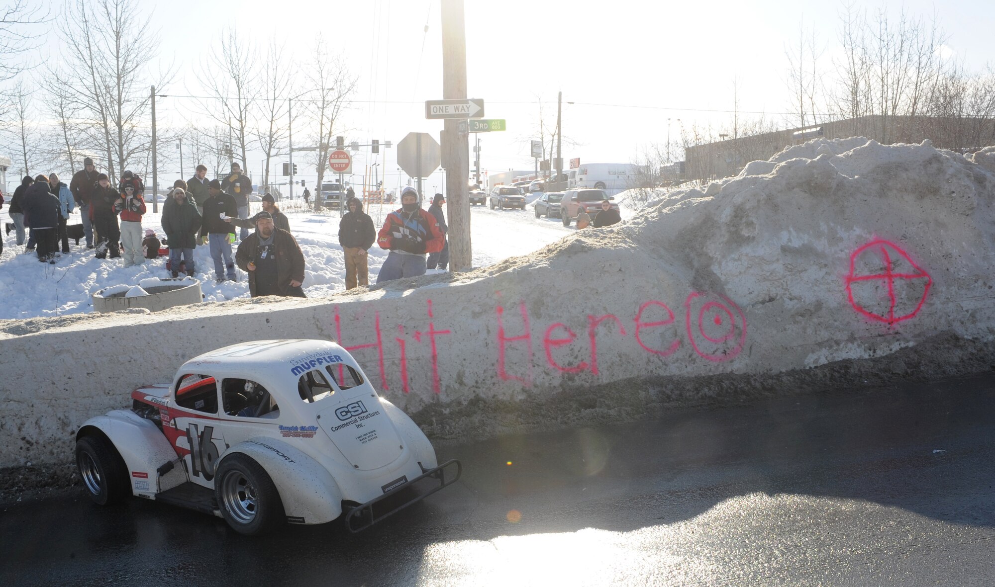 ANCHORAGE, Alaska -- A Legends car crashed into the snow bank going into turn four on the Fur Rondy Grand Prix track. T.J. Clark, president of  the Alaska Sports Car Club, invited the military to be part of the Grand Prix kick off March. 6, 2009. (U.S. Air Force photo/Senior Airman Matthew Owens)

