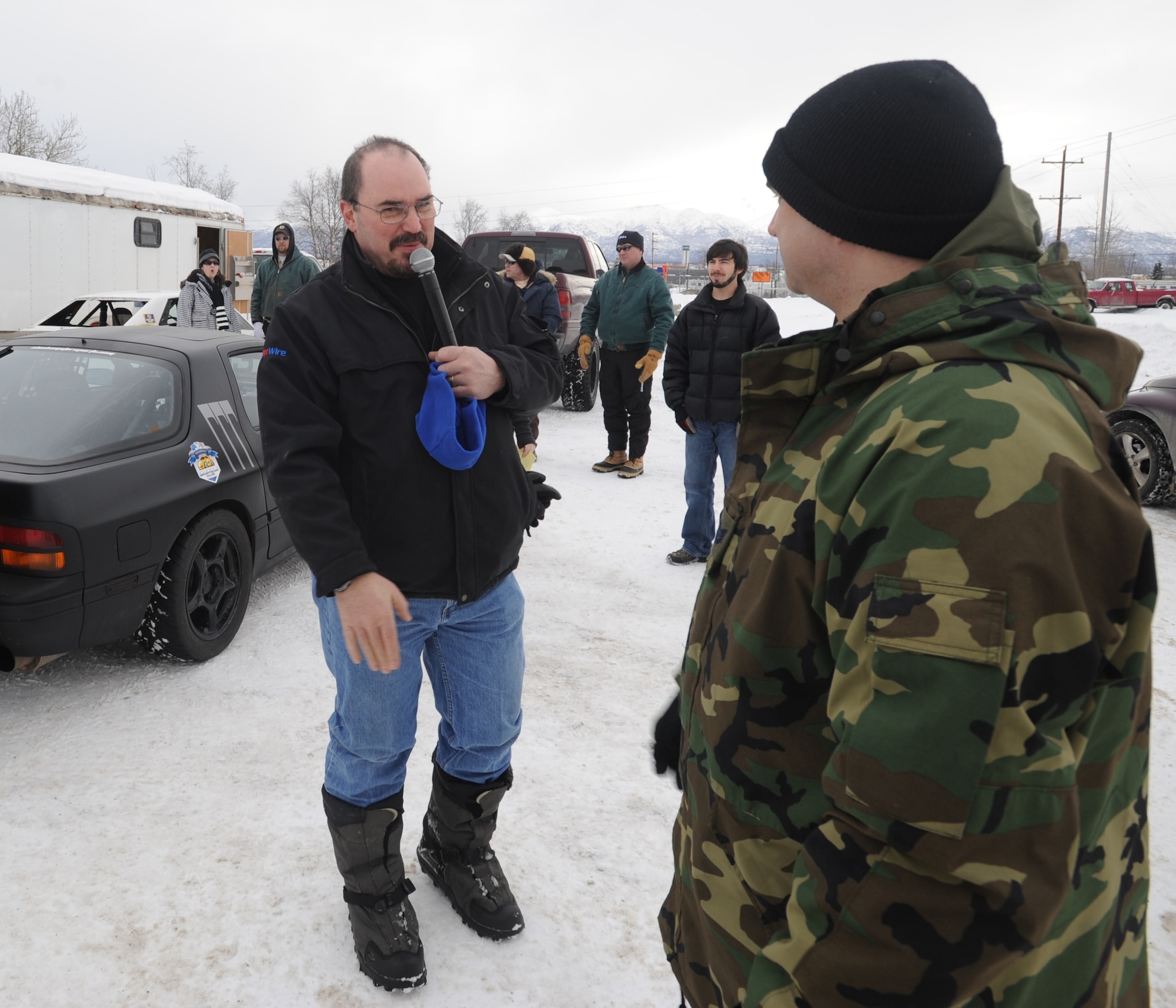 ANCHORAGE, Alaska -- Tech. Sgt. Mike Rogers, 3rd Communications Squadron, dicusses his re-enlistment for another five and a half years with Cary Carrigan, 100.8 AM KUDO program director and radio personality, before the start of the Fur Rondy Grand Prix March. 6, 2009. Rogers, who hails from Murfreesboro, Tenn., has been in the Air Force 15 years. He is the first person to re-enlist at the Grand Prix. (U.S. Air Force photo/ Senior Airman Matthew Owens)
