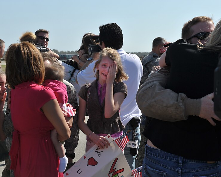 MOODY AIR FORCE BASE, Ga. -- A young girl is over whelmed with emotion after being reunited with her father who returned from a six month deployment to Bagram Air Base, Afghanistan, here March 9. More than 300 Moody Airmen returned after a deployment in support of Operation Enduring Freedom. (U.S. Air Force photo by Senior Airman Javier Cruz Jr.)