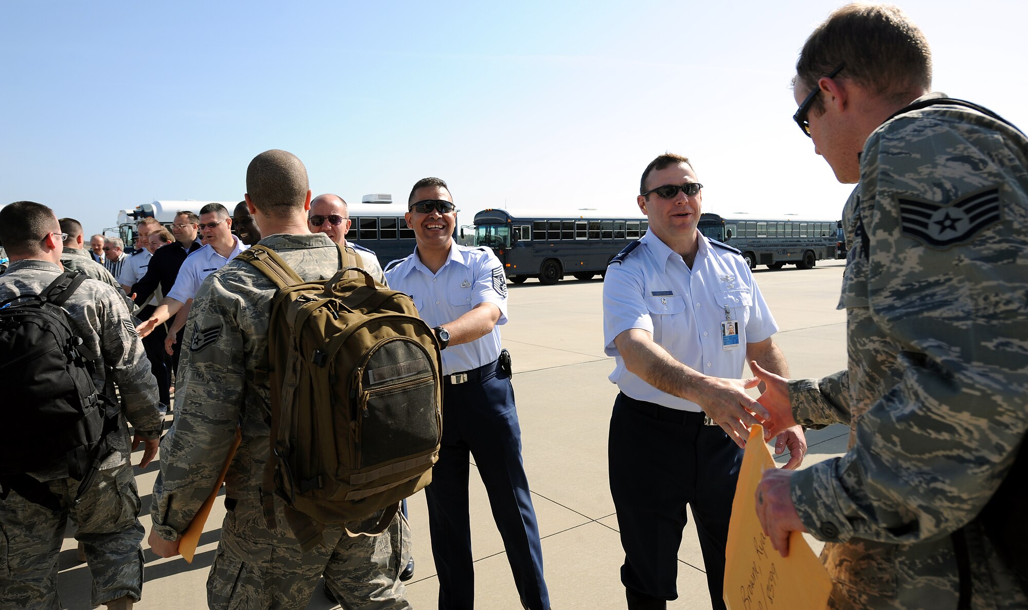 MOODY AIR FORCE BASE, Ga. -- Col. Henry Santicola, 23rd Wing vice commander, shakes hands with deployed members from the 75th Aircraft Maintenance Squadron who return after a six month deployment here March 9. The 75th AMU was deployed to Bagram Air Base, Afghanistan, in support of Operation Enduring Freedom. (U.S. Air Force photo by Airman Joshua Green)