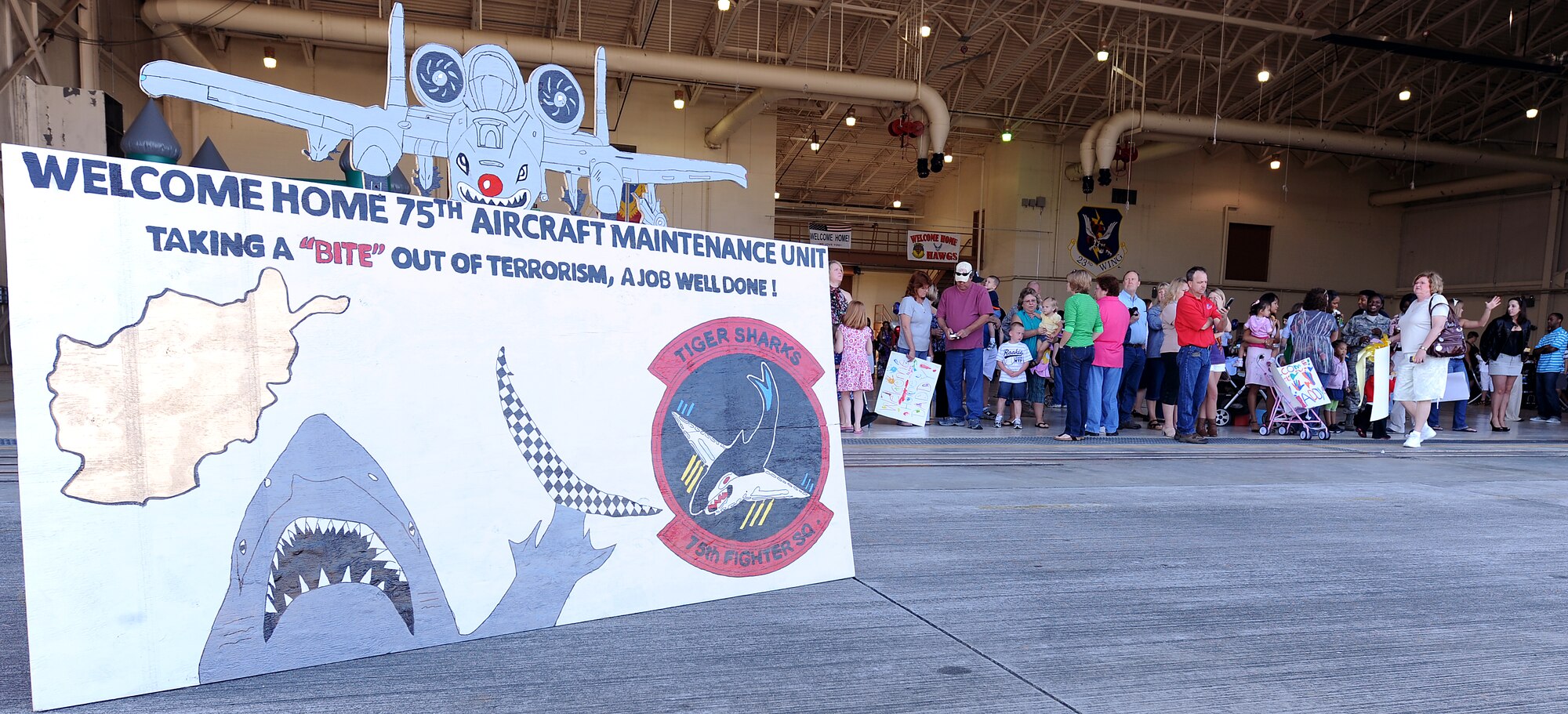 MOODY AIR FORCE BASE, Ga. -- Family, friends and loved ones await the arrival of members from the 75th Aircraft Maintenance Unit here March 9. Members from the 75th AMU have been deployed to Bagram Air Base, Afghanistan, for about six months. (U.S. Air Force photo by Airman Joshua Green) 