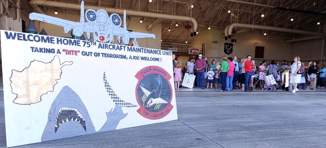 MOODY AIR FORCE BASE, Ga. -- Family, friends and loved ones await the arrival of members from the 75th Aircraft Maintenance Unit here March 9. Members from the 75th AMU have been deployed to Bagram Air Base, Afghanistan, for about six months. (U.S. Air Force photo by Airman Joshua Green) 