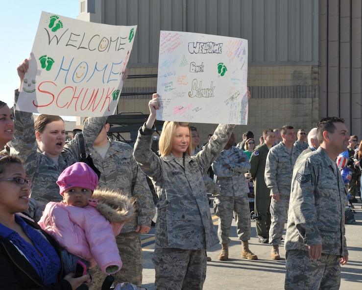 MOODY AIR FORCE BASE, Ga. -- Approximately 100 Airmen from Moody Air Force Base returned after a three month deployment to Balad Air Base, Iraq, here March 6. Families and friends of deployed members gathered with banners and signs on the flightline to welcome them home. (U.S. Air Force photo by Senior Airman Javier Cruz Jr)