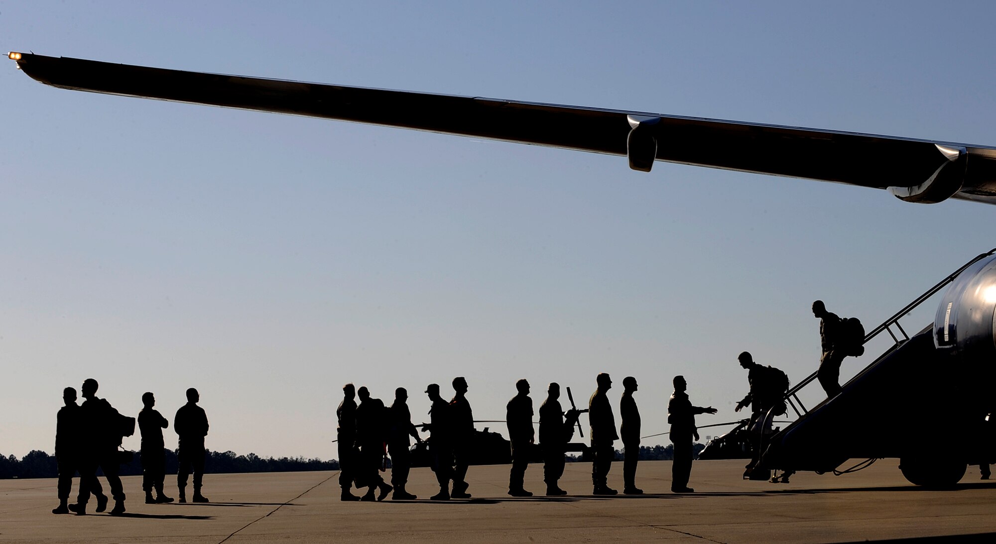 MOODY AIR FORCE BASE, Ga. -- Members from the 41st Rescue Squadron return home from a deployment here March 6. The Airmen were greeted by base leadership as they got off the airplane. (U.S. Air Force photo by Senior Airman Brittany Barker)  