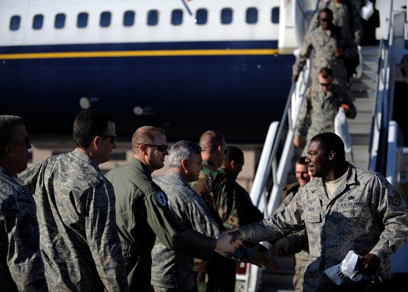 MOODY AIR FORCE BASE, Ga. -- Members from the 41st Rescue Squadron return home from a deployment here March 6. The Airmen were greeted by base leadership as they got off the plane. (U.S. Air Force photo by Senior Airman Brittany Barker)  