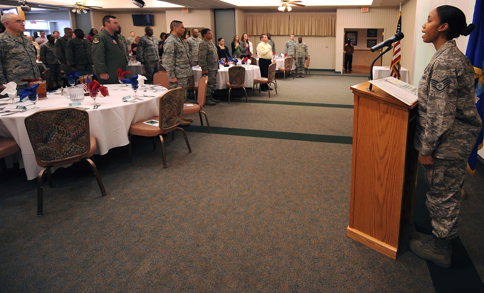 MOODY AIR FORCE BASE, Ga. -- Staff Sgt. Ceressa Brunskill, Air Force Reserve Officers’ Training Corps Detachment 172 knowledge operator, sings the National Anthem after opening remarks during the National Prayer Luncheon held at the Moody Field Club here March 5. The luncheon's theme was based on night vision goggles, which symbolized hope and to not give up even during dark times. (U.S. Air Force photo by Airman Joshua Green) 