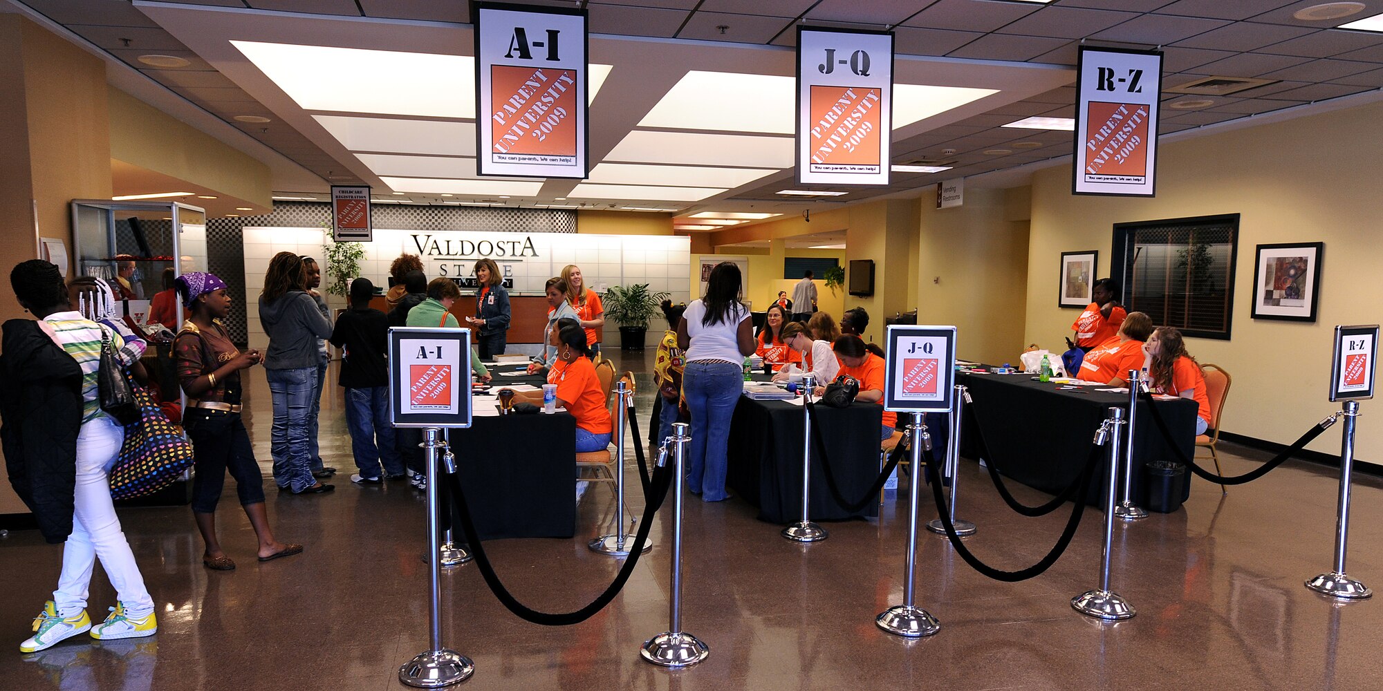 MOODY AIR FORCE BASE, Ga. -- Attendees at the Parent University Workshop held at Valdosta State University, Valdosta, Ga., are greeted as they sign in for the event March 7.  The event also included free child care services provided by staff members from the Child Development Center at Moody. (U.S. Air Force photo by Airman Joshua Green) 