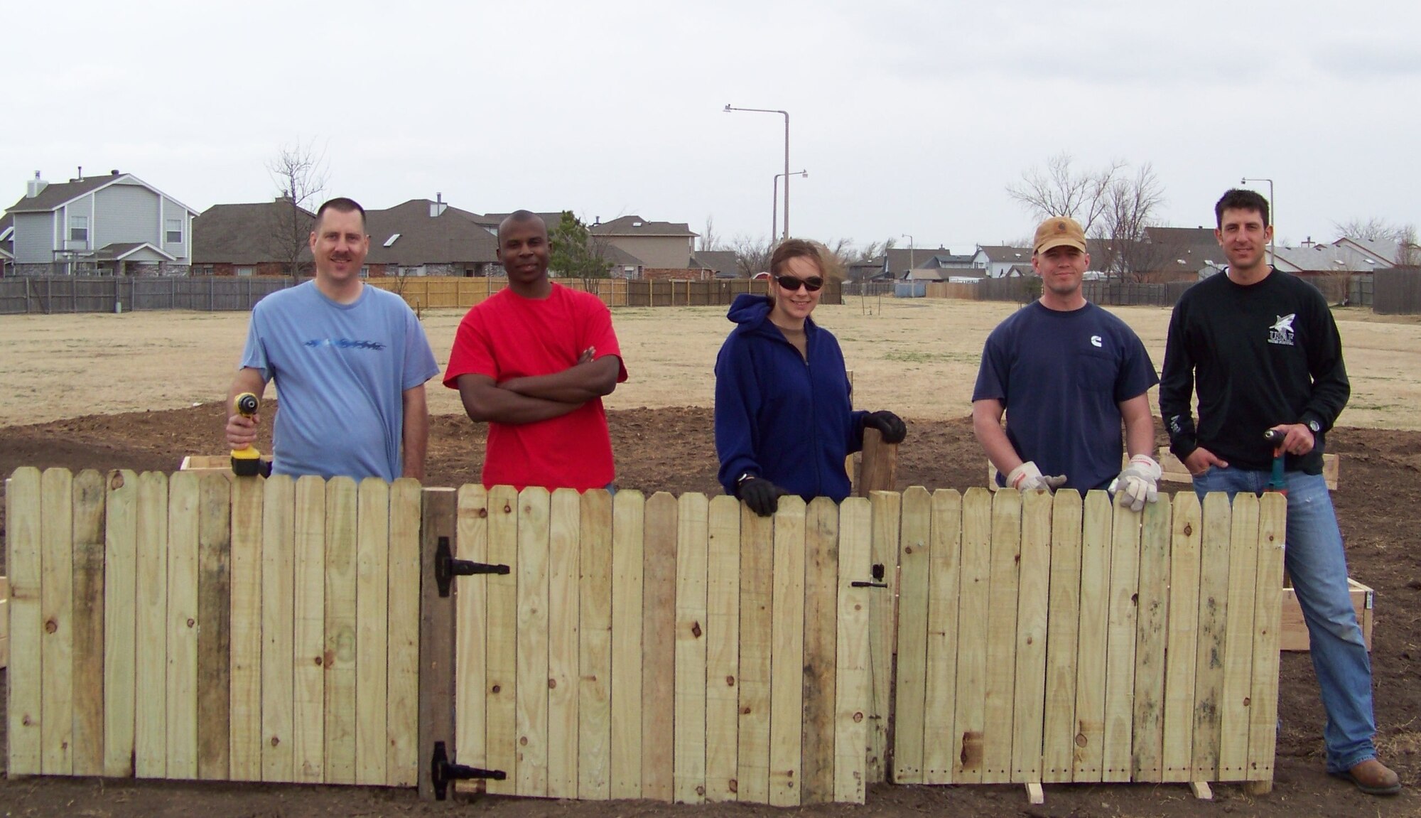 Volunteers from the 552nd Air Control Wing spent their day off helping to construct a community garden in Moore.