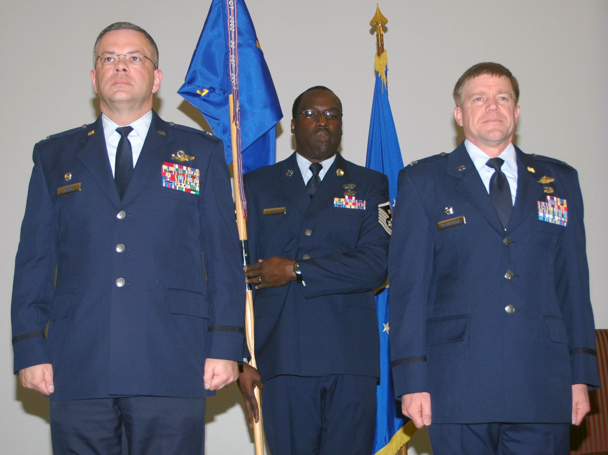DOVER AIR FORCE BASE, Del. -- From left to right is 512th Airlift Wing Commander Col. Randal L. Bright, 512th Operations Support Flight First Sergeant Master Sgt. Calvin Little, and the new 512th Operations Group Commander Col. Karl A. Schmitkons. Colonel Schmitkons assumed command of the Air Force Reserve's 512th OG in a ceremony March 8 at 10:30 at the Landings. Colonel Schmitkons is a command pilot with more than 5,600 hours in the C-130 and is scheduled to learn to fly the C-5. He assumes command of a 400 person organization, which flies the C-17 Globemaster and C-5 Galaxy. (U.S. Air Force photo/Capt. Marnee A.C. Losurdo)