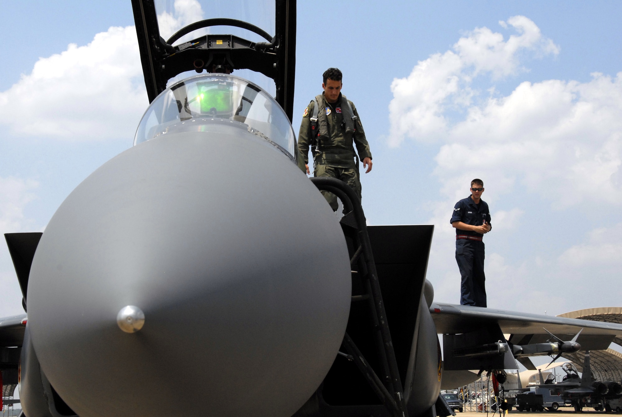 EGLIN AIR FORCE BASE, Fla. - Maj. Jeff Geraghty, 40th Flight Test Squadron, performs a walk around on his jet before a test mission. The 40th FLTS pilots fly developmental test missions in F-15s, F-16s, A-10Cs and UH-1 helicopters. (U.S. Air Force photo/Staff Sgt. Kevin Davidson)