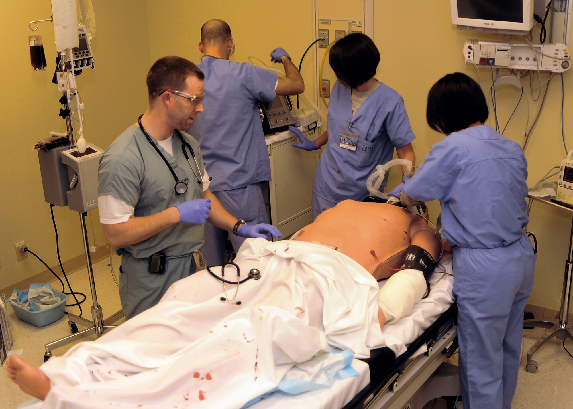 Students train in a real-time simulation that will help them prepare for their upcoming deployments Feb. 17 at the St. Louis University Hospital in Missouri. The simulators used in the training program are the latest patient simulation technology that are able to speak, breathe, bleed and can be administered medication that will affect their vital signs. (U.S. Air Force photo/Airman 1st Class Wesley Farnsworth) 
