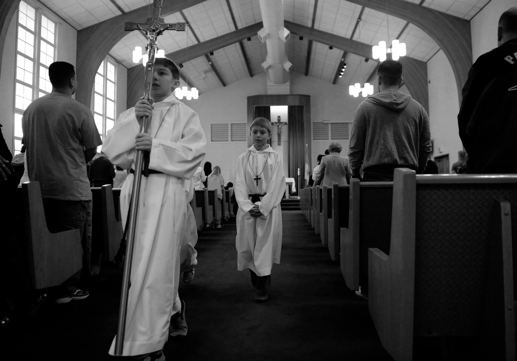 MOUNTAIN HOME AIR FORCE BASE, Idaho -- Patrick Beaty and Bridger Beaty prepare for Sunday morning mass Feb. 22. The Beaty's volunteer as altar boys for Sunday morning Catholic masses at Liberty Chapel. The base chapel hosts all religions and has many different programs to suit everyone's beliefs. (U.S. Air Force photo/ Senior Airman Stephany Miller) 
 

