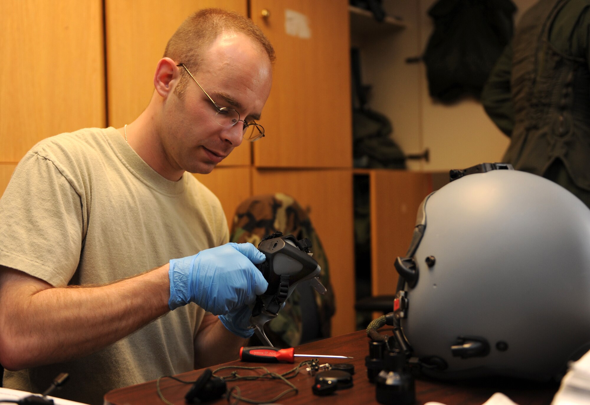 NELLIS AIR FORCE BASE, Nev. -- Tech. Sgt. Richard Gage, Red Flag Air Expeditionary Wing aircrew flight equipment from Langley Air Force Base, Va., inspects an aircrew flight mask while participating in Red Flag 09-3 March 3. Throughout Red Flag, Aircrew Flight Equipment personnel conduct pre-flight and post-flight survival gear inspections. Red Flag is the U.S. Air Force’s air combat training exercise involving U.S. and allied air forces. The exercise is conducted on the 15,000-square-mile Nevada Test and Training Range north of Las Vegas. (U.S. Air Force photo/Airman 1st Class Debbie Lockhart)