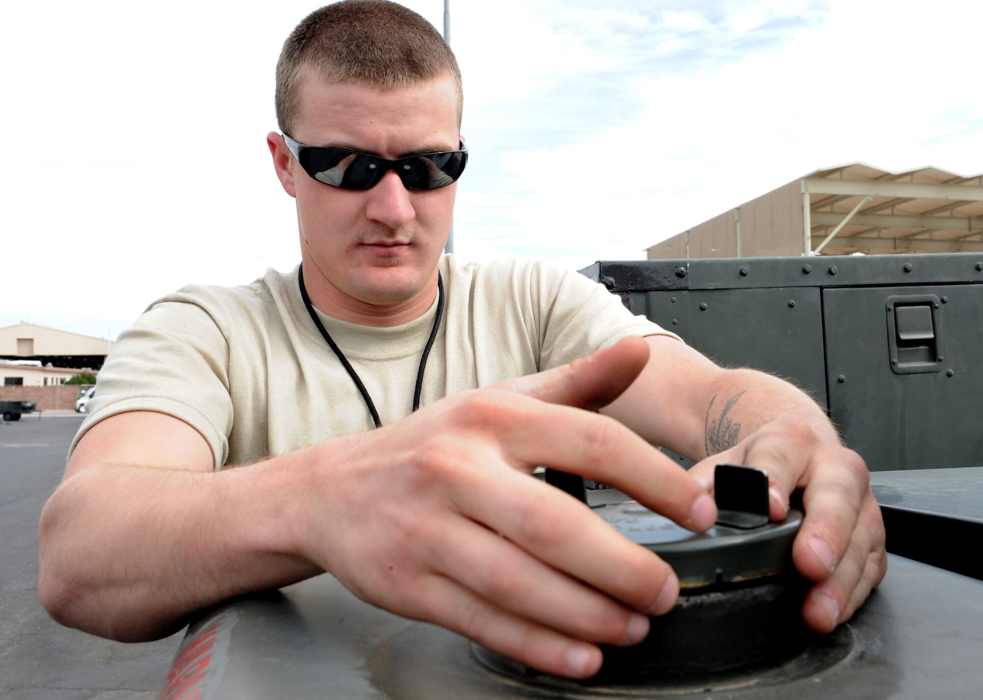 NELLIS AIR FORCE BASE, Nev. -- Senior Airman Corey Roge, 1st Equipment Management Squadron journeyman from Langley Air Force Base, Va., checks the fuel in a generator while participating in Red Flag 09-3 March 2. Red Flag is the U.S. Air Force’s air combat training exercise involving U.S. and allied air forces. The exercise is conducted on the 15,000-square-mile Nevada Test and Training Range north of Las Vegas. (U.S. Air Force photo/Airman 1st Class Debbie Lockhart)