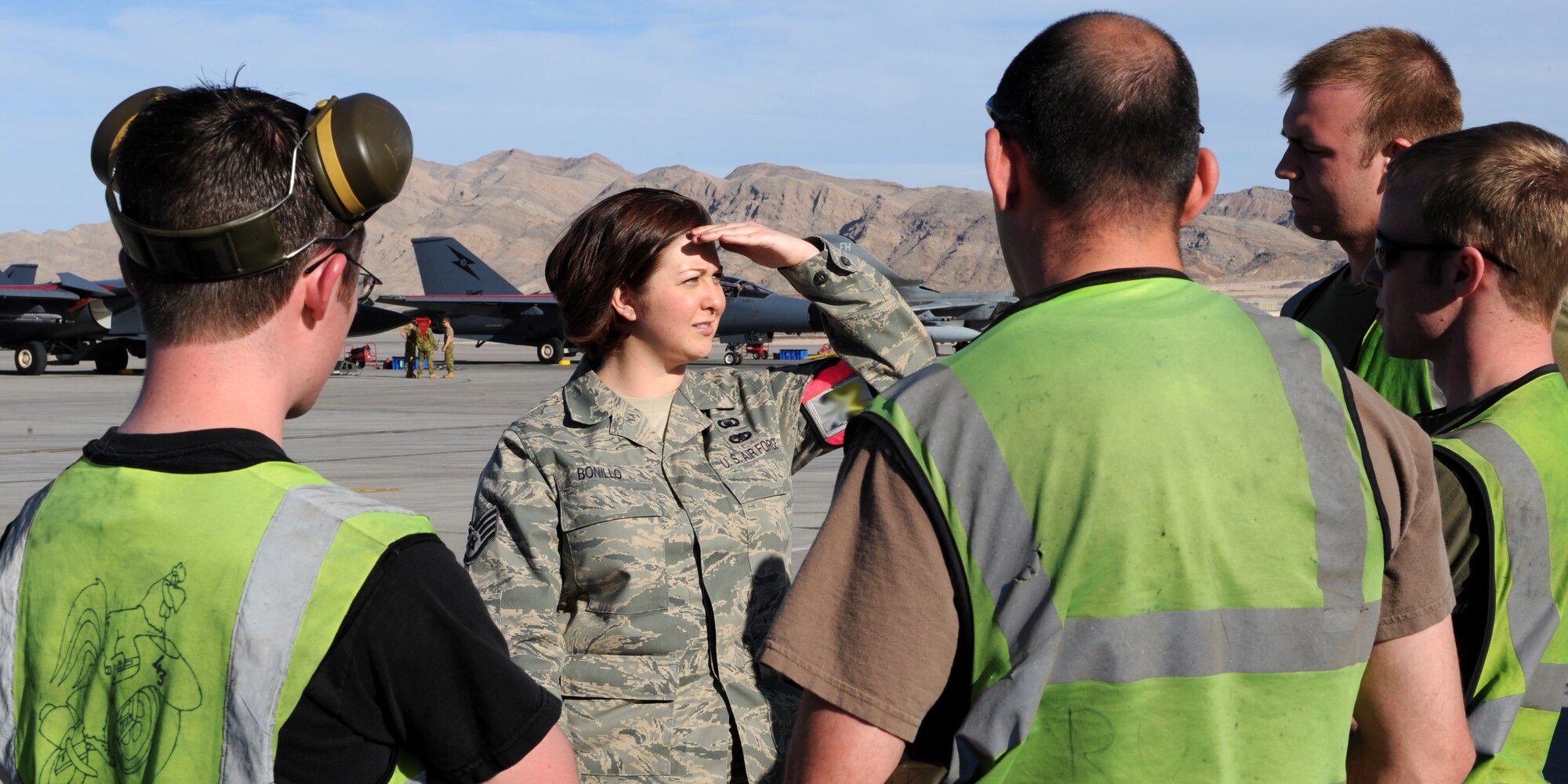 NELLIS AIR FORCE BASE, Nev. -- Staff Sgt. Aimee Bonillo, Red Flag Air Expeditionary Wing chaplain's assistant from Mountain Home Air Force Base, Idaho, speaks with members of the United Kingdom Royal air force while participating in Red Flag 09-3 March 3. The chapel team provides counseling, advice, and ensures everyone's spiritual needs are met. More than 90 aircraft, 2000 personnel and 27 units are participating in the historic exercise. (U.S. Air Force photo by Airman 1st Class Debbie Lockhart)