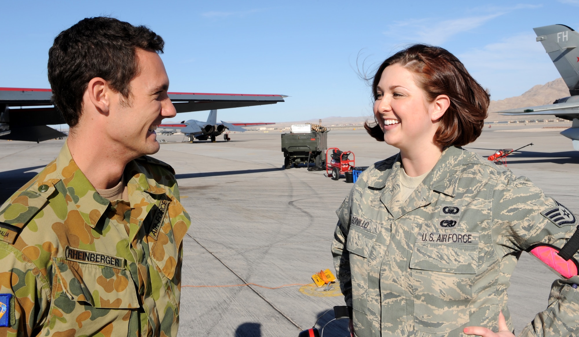 NELLIS AIR FORCE BASE, Nev. -- Staff Sgt. Aimee Bonillo, Red Flag Air Expeditionary Wing chaplain's assistant from Mountain Home Air Force Base, Idaho, speaks with Flag Officer Beau Rheinberger, from the Royal Australian air force’s 6th Squadron while participating in Red Flag 09-3 March 3. The chapel team provides counseling, advice, and ensures everyone's spiritual needs are met. More than 90 aircraft, 2000 personnel and 27 units are participating in the historic exercise. (U.S. Air Force photo by Airman 1st Class Debbie Lockhart)