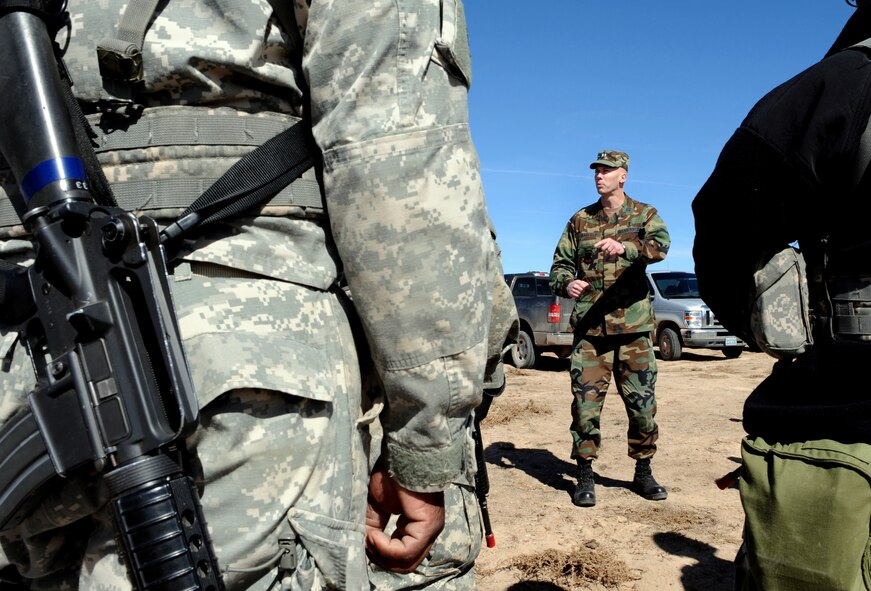 NELLIS AIR FORCE BASE, Nev. -- Chaplain (Capt.) Steven Barfield, Red Flag Air Expeditionary Wing chaplain from Mountain Home Air Force Base, Idaho, speaks with members of the Army's 108th Air Defense Artillery Brigade for those participating in the three-week air combat exercise, Red Flag 09-3 March 2. The chapel team provides counseling, advice and ensures everyone's spiritual needs are met. Red Flag is a realistic combat training exercise involving the air forces of the United States and its allies. The exercise is conducted on the 15,000-square-mile Nevada Test and Training Range, north of Las Vegas. (U.S. Air Force photo/Airman 1st Class Debbie Lockhart)