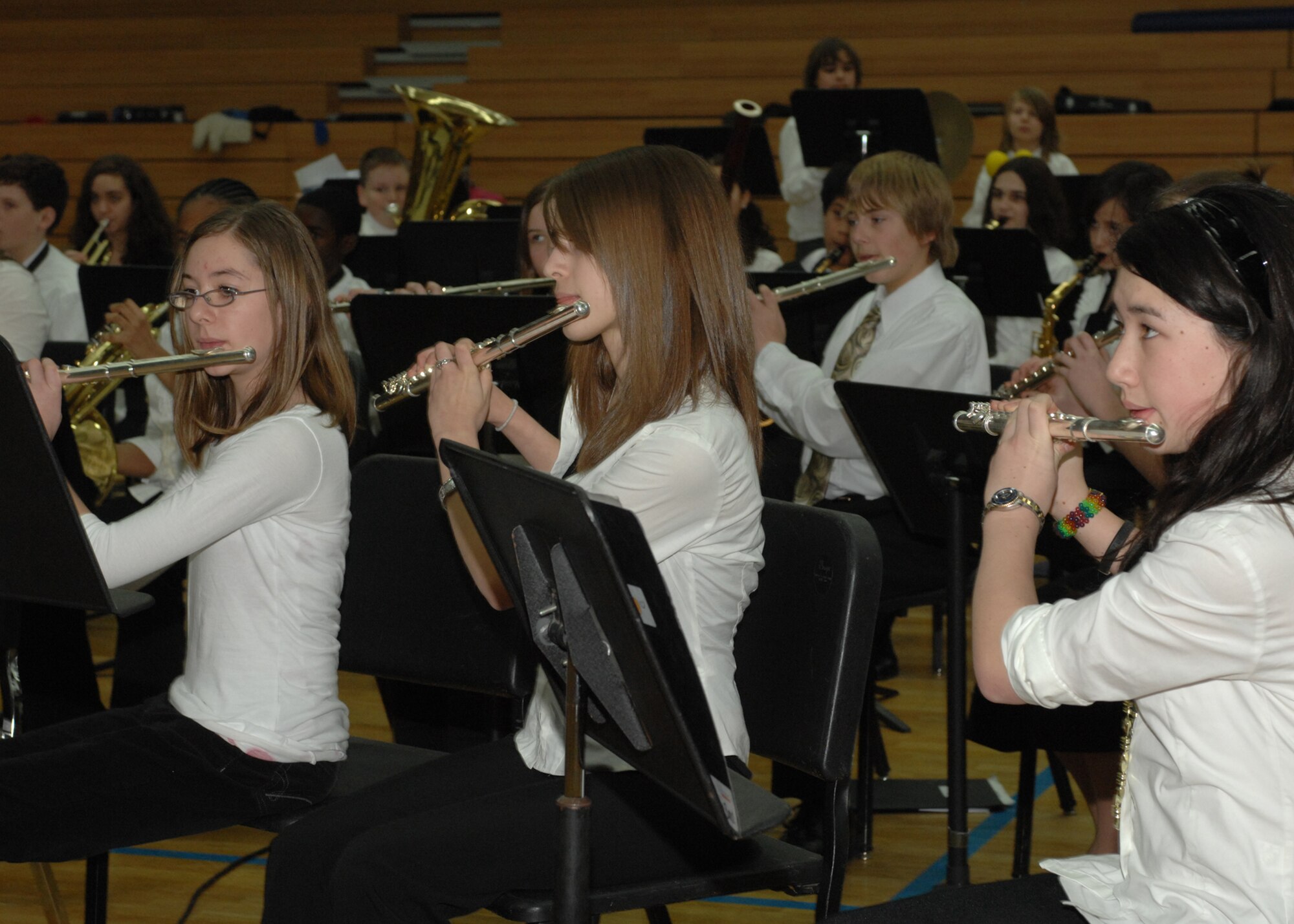 SPANGDAHLEM AIR BASE, Germany -- Flautists perform with other members of the Kaiserslautern School District Honor Band March 4, 2009 for the Spangdahlem community at the Skelton Memorial Fitness Center. Advanced middle and high school band students from Department of Defense schools only had two joint rehearsals prior to the performance. (U.S. Air Force photo Senior Airman Jenifer H. Calhoun)