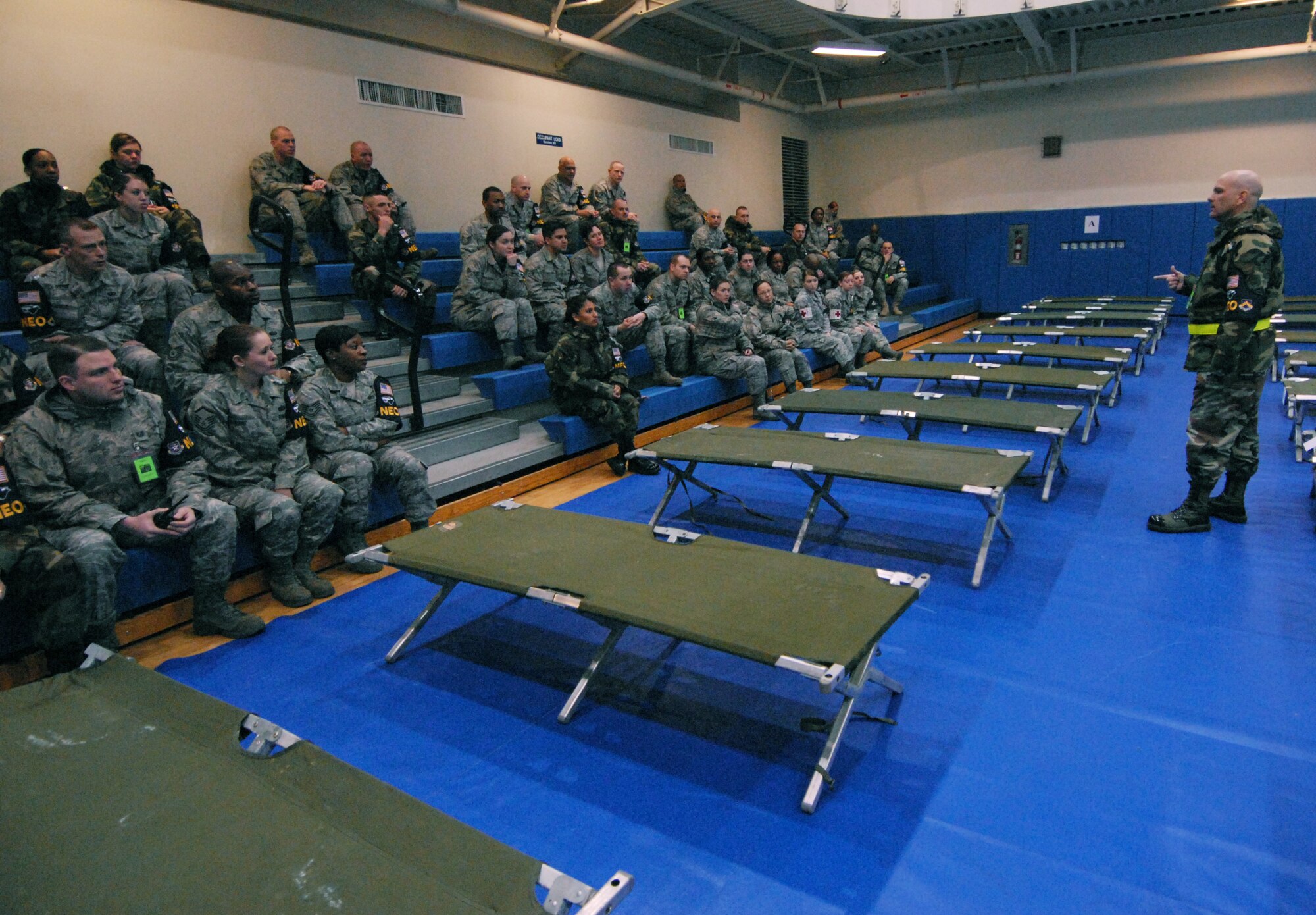 Major Stephen Jordan, 8th Force Support Squadron commander, briefs participants in the Non-combatant Evacuation Operation inspection at Kunsan Air Base, Republic of Korea, March 6, 2009. The NEO inspection tests the 8th Fighter Wing's capabilities to evacuate non-combatants from the country. (U.S. Air Force Photo/Senior Airman Gustavo Gonzalez)