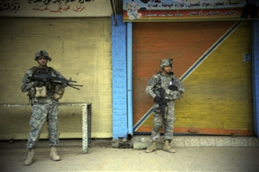 U.S. Army soldiers from the 8th Regiment, 1st Cavalry Division provide security during a clearing and census operation in the Zinjali neighborhood of Mosul, Iraq, on March 1, 2009.  