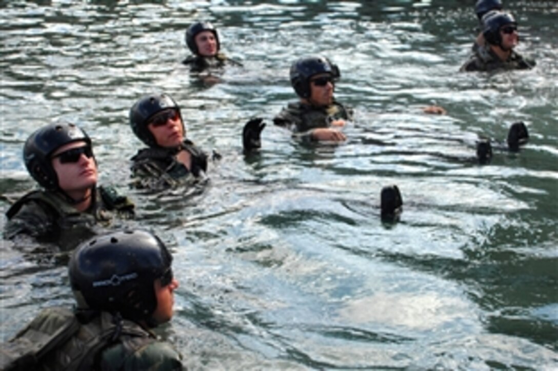 U.S. Navy Special Warfare Combatant-craft crewmen candidates check the integrity of their floatation devices before going to sea in Coronado, Calif., March 5, 2009. The 14-week course teaches candidates the skills they need as members of the Naval Special Warfare Boat Teams, including navigation, craft maintenance and repair, towing, anchoring and weapons.