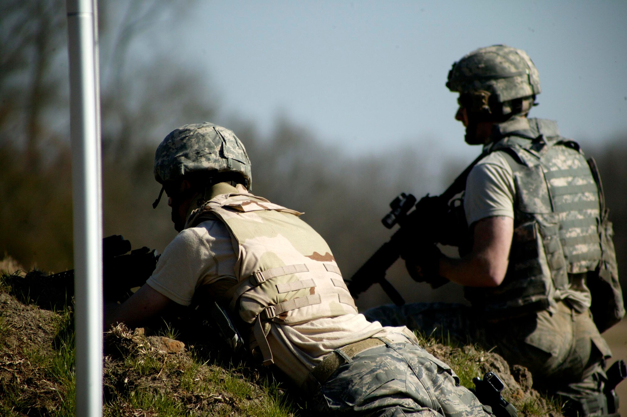 ORANGEBURG, S.C.-- Two explosive ordnance disposal Airmen provide cover during the Tactical Survival Advanced Course March 5. (U.S. Air Force photo/Staff Sgt. Holly Brown)