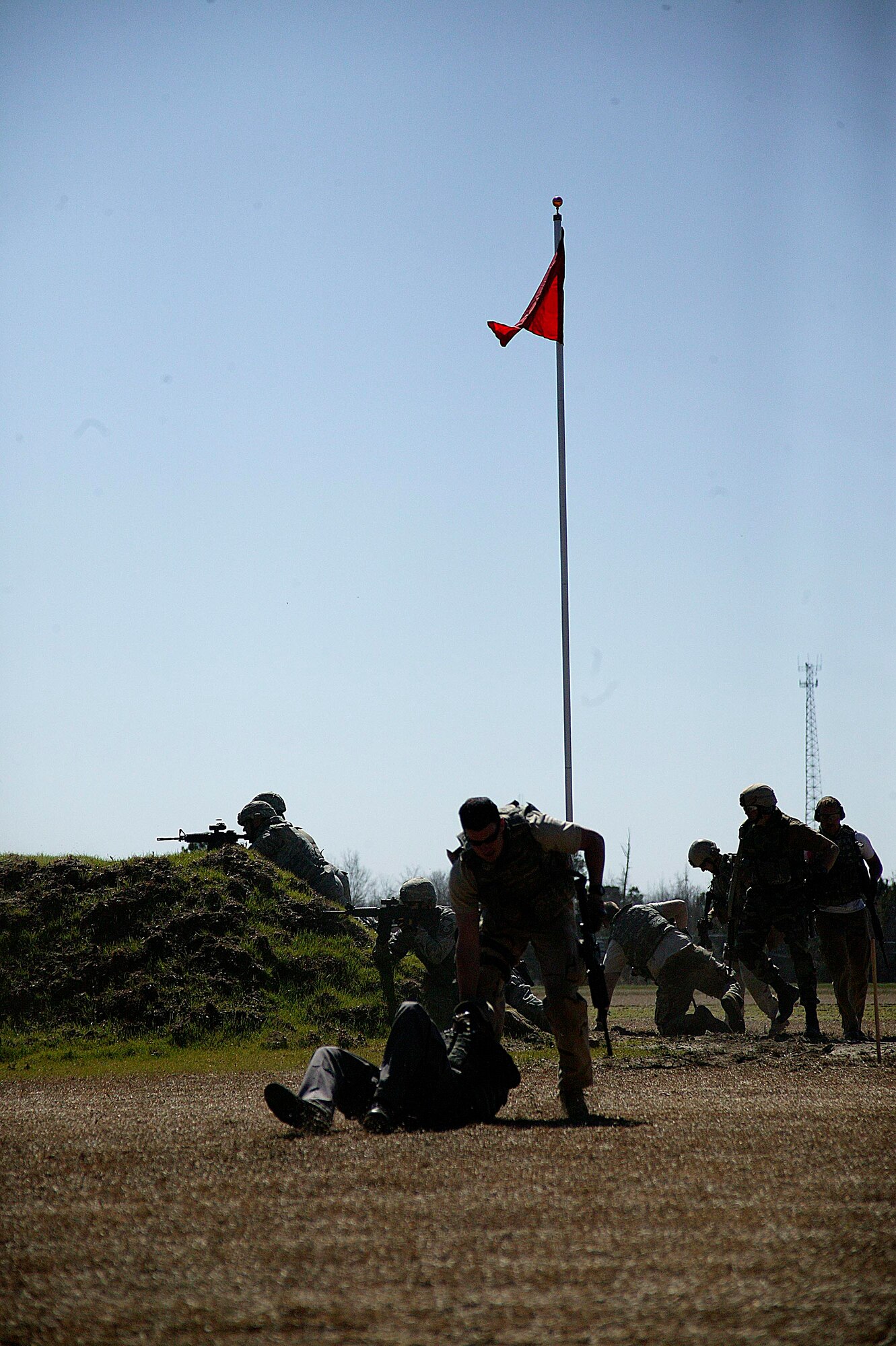 ORANGEBURG, S.C.-- Explosive ordnance disposal Airmen fall back from enemy fire during a convoy operation exercise March 5. (U.S. Air Force photo/Staff Sgt. Holly Brown)