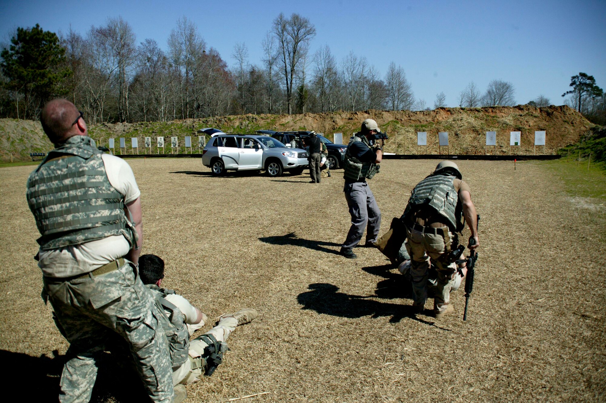ORANGEBURG, S.C.-- Explosive ordnance disposal Airmen drag "wounded" teammates to safety as other teammates provide cover in a live-fire exercise March 5. (U.S. Air Force photo/Staff Sgt. Holly Brown)