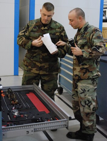Senior Airman Brian Reed, 9th Aircraft Maintenance Squadron HAZMAT waste monitor, and Senior Airman Lane Hoglund, 9th AMXS VCO and PMEL monitor, check accountability for tools March 10. The section is accountable for all tools necessary to perform maintenance on the U-2. (Photo by Airman 1st Class Dan Rosenau)