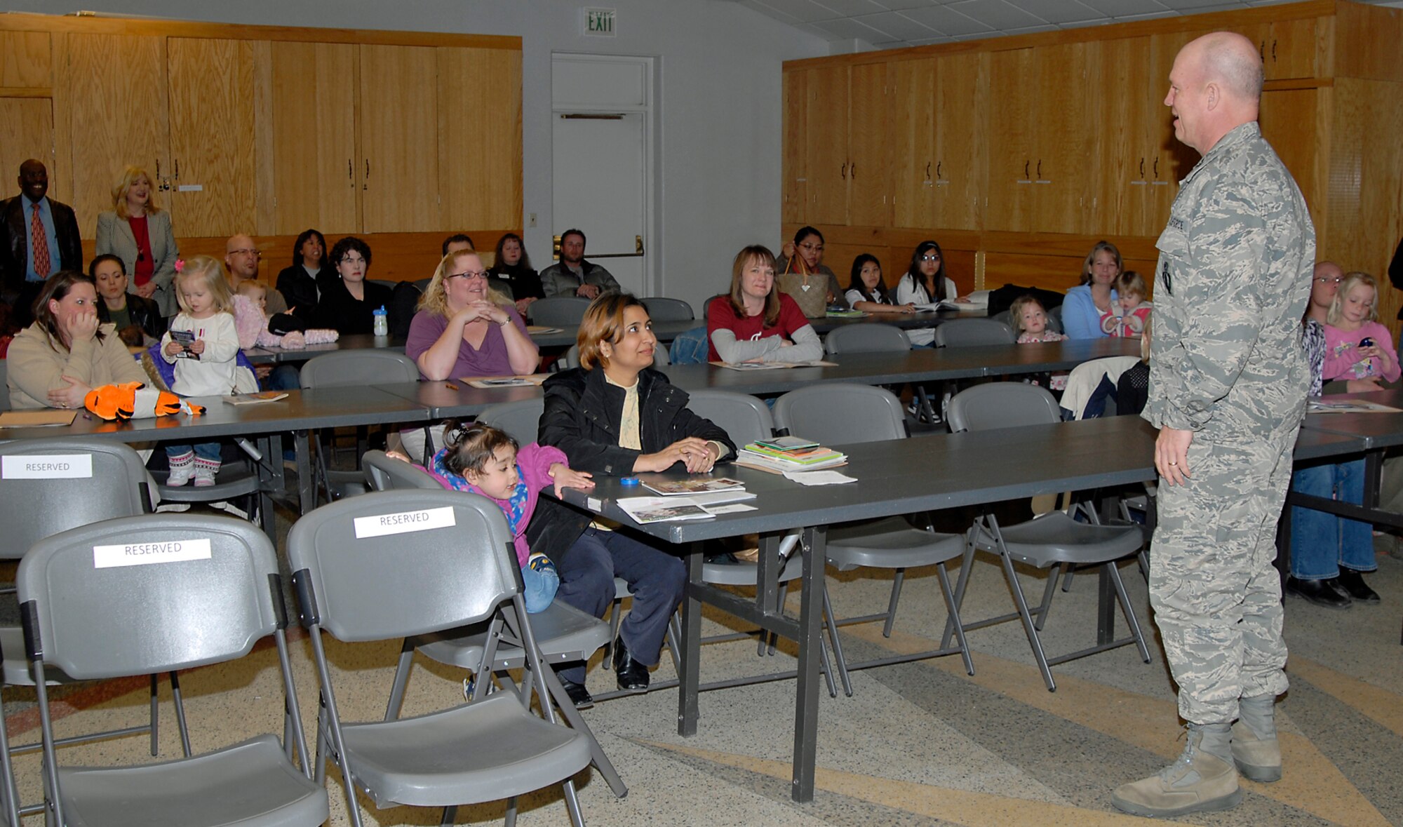 Col. Jay Raymond, 21st Space Wing commander welcomes the spouses of those deploying or already deployed to the first-held evening Spouses Deployment Briefing at the Peterson Air Force Base Chapel Feb. 19. 