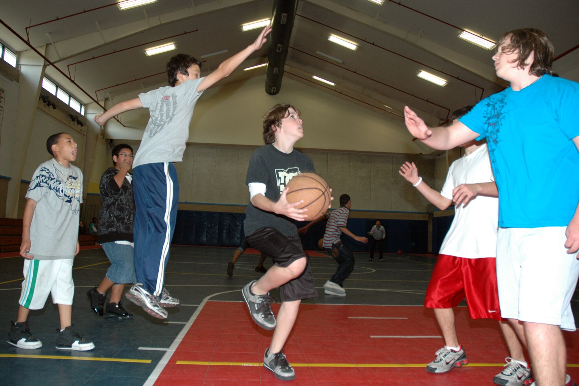 EGLIN AIR FORCE BASE, Fla. -- Children play a game of basketball at the Eglin Youth Center March 5. Keeping active is a important factor to maintaining a healthy life. FitFactor, a U.S. Air Force Services Family Member Programs initiative, promotes physical activity and healthy eating selections for youth between the ages of 6-18. (U.S. Air Force photo/ Airman Anthony Jennings)