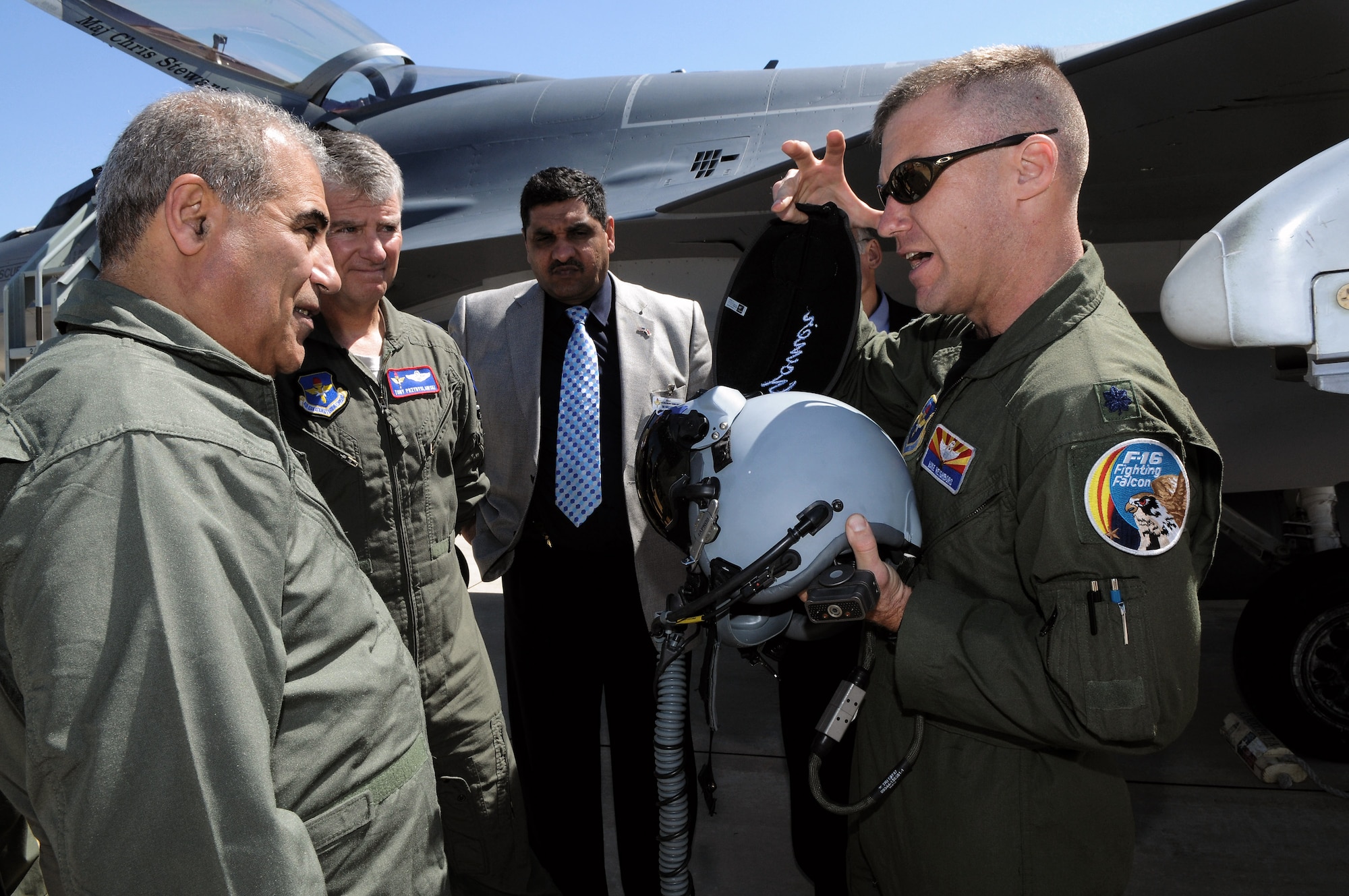 Lt. Col. Mike Neighbors briefs Iraqi General Nasier Arkan Al-Abadi, Joint Forces Vice Chief of Staff, and Maj. Gen. Anthony Przybyslawsk, Air Education and Training vice commander, about equipment used by F-16 pilots. The general visited Randolph Air Force Base, Texas, March 4. Colonel Neighbors is an F-16 pilot and director of operations for the 152nd Fighter Squadron. (U.S. Air Force photo)
