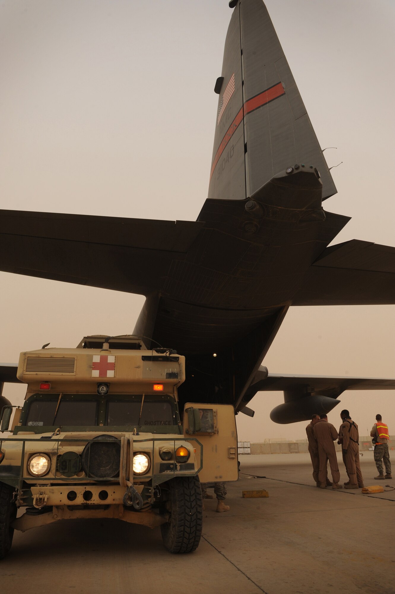 AL ASAD AIRFIELD, Iraq ? An ambulance varient of a HMMWV sits ready to off-load patients onto a 777th Expeditionary Airlift Squadron C-130 Hercules Feb. 27. Airmen in the 332nd Expeditionary Aeromedical Evacuation Flight transport servicemembers wounded, injured or sick from remote locations to a higher level of medical care. (U.S. Air Force photo/Senior Airman Elizabeth Rissmiller)