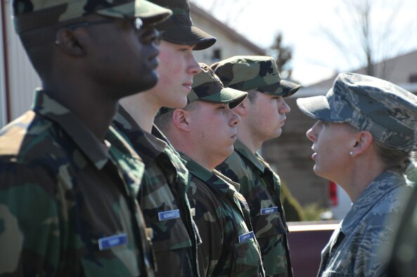 Master Sgt. Donna Roper, BRATS cadre, inspects a trainee during an open ranks inspection March 8 at Stratton Air National Guard Base, N.Y. The Stratton BRATS program prepares recruits for the atsmosphere they will encounter in Basic Military Training at Lackland Air Force Base, Texas.
