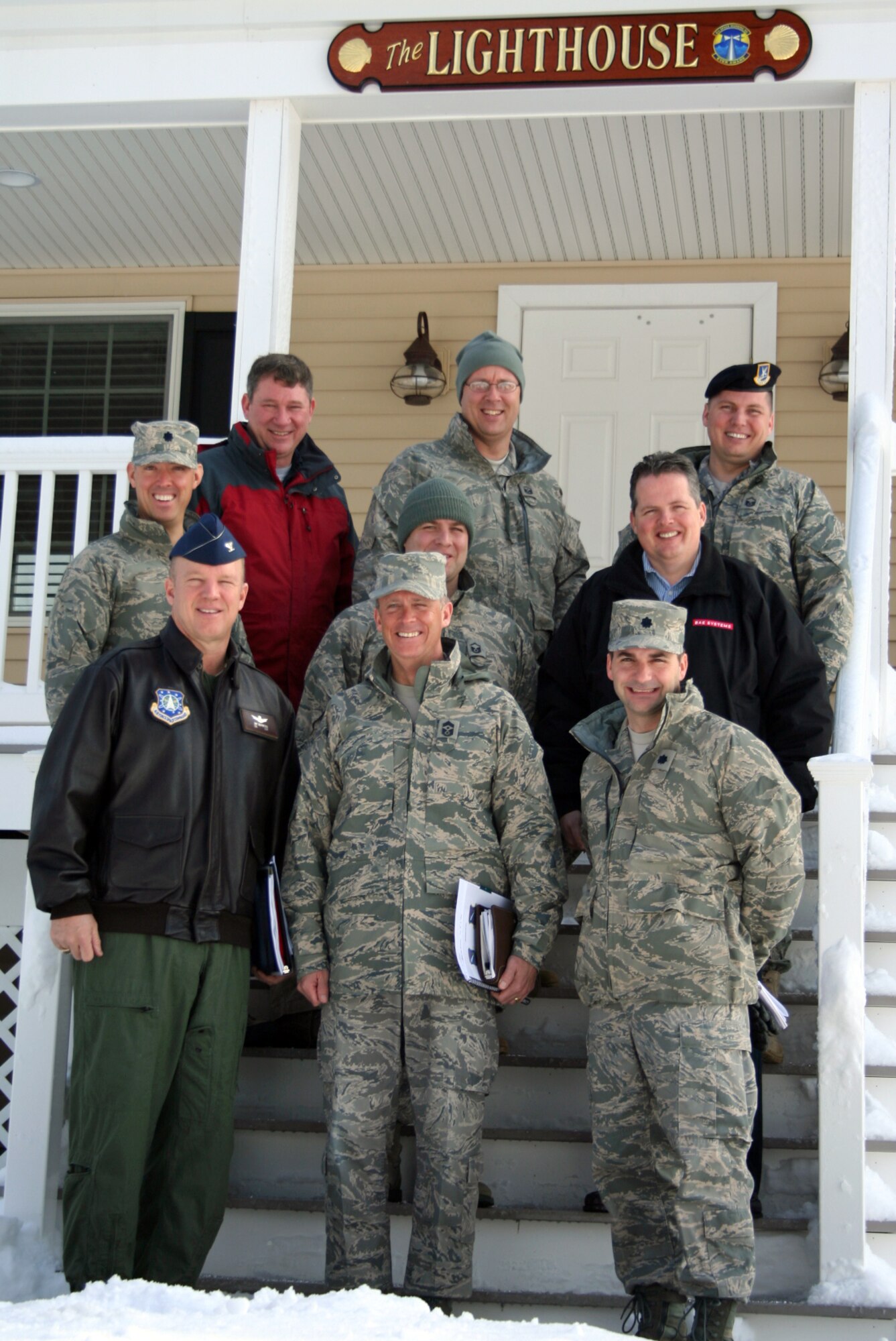 Cape Cod Air Force Station and 21st Space Wing leadership tour facilities at the Pave PAWS radar site, Tues. March 3. Front row from left: Col. Jay Raymond, 21st SW commander, Chief Master Sgt. Tim Omdal, 21st SW command chief, Lt. Col. Max Lantz, 6th Space Warning Squadron commander. Second row from left: Lt. Col. Scott Schroff, 6 SWS director of operations, Master Sgt. Kevin Smith, 6 SWS operations superintendent, Paul Connolly, Cape Cod Air Force Station BAE Systems site manager. Back row from left: Steve Mellin, 6th SWS support officer, Master Sgt. Scott Crossman, 6th SWS first sergeant, Master Sgt. Jake Blake, 6th SWS Chief of Security Forces. (Air Force photo by Barbara Burnett)