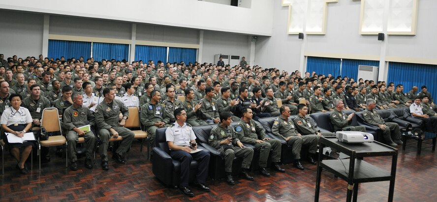 U.S., Thai and Singaporean aircrew members listen to an operations brief on March 8 at Korat Royal Thai Air Force Base, Thailand, in preparation for Cope Tiger 2009. Cope Tiger is an annual, multilateral large force aerial exercise conducted in Thailand including U.S., Thai and Singaporean military forces. The two-week exercise includes both flying and humanitarian missions conducted in Korat and Udon Thani, Thailand. Cope Tiger 2009 kicked off March 9 and will conclude March 20. (U.S. Air Force photo/Staff Sgt. Angelique Perez)