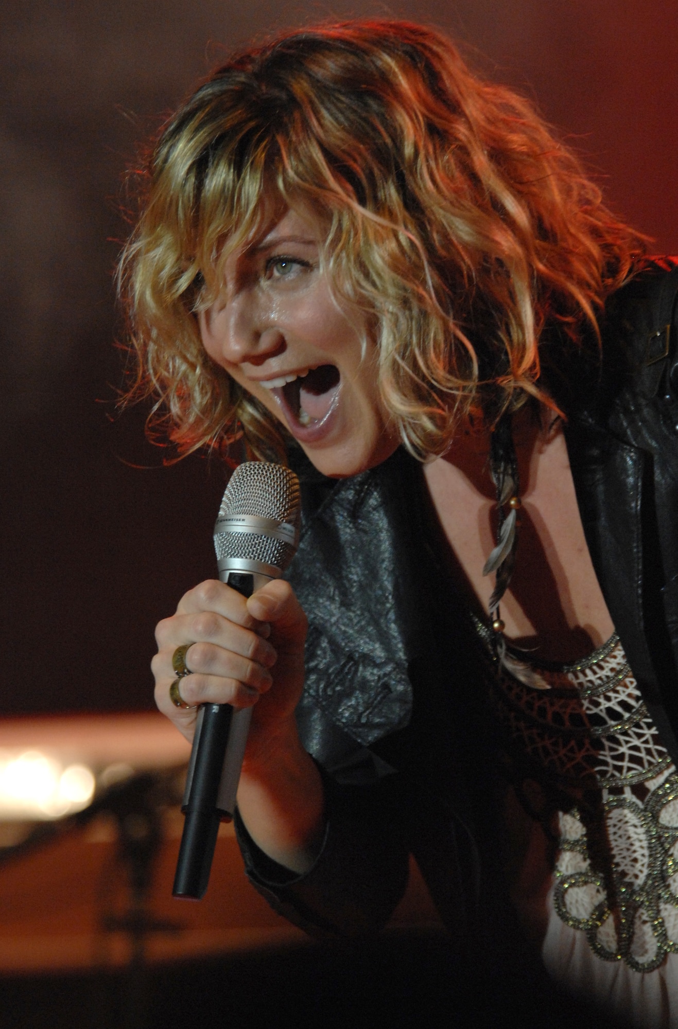 Sugarland vocalist, Jennifer Nettles, sings to Aviano Airmen during a special concert on base March 6 sponsored by Armed Forces Entertainment. Aviano was the first stop on the country music band's first European tour. (U.S. Air Force photo/Airman 1st Class Tabitha M. Mans)     