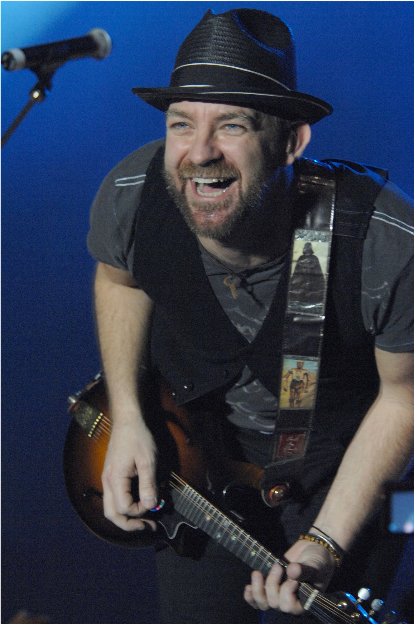Sugarland guitarist/vocalist, Kristian Bush performs for Aviano Airmen and their families March 6 in a hangar on the base flightline.  During their month long tour in Europe Sugarland will visit other military installations in Italy, Germany and the Netherlands.  (U.S. Air Force photo/Airman 1st Class Tabitha M. Mans)   