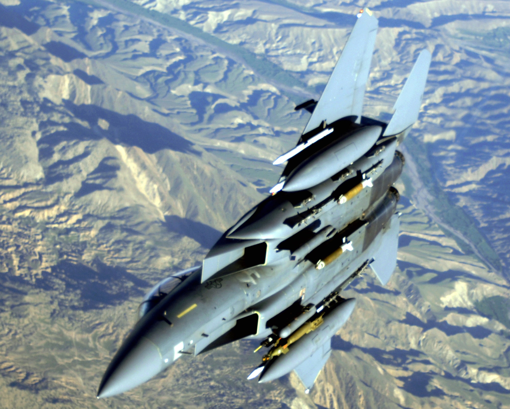 An F-15E Strike Eagle soars over the mountains and high desert of Afghanistan providing close-air support and aerial overwatch to troops on the ground engaged in rooting out insurgent sanctuaries and support networks. The Strike Eagle is a dual-role fighter designed to perform air-to-air and air-to-ground missions. (U.S. Air Force photo/Master Sgt. Lance Cheung)