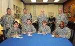 Team Randolph senior leaders sign their Air Force Assistance Fund pledge forms at the Air Education and Training Command headquarters at Randolph Air Force Base, Texas, March 10. Pictured from left are: Chief Master Sgt. Max Grindstaff, 12th Flying Training Wing command chief master sergeant; Col. Jacqueline Van Ovost, 12th Flying Training Wing commander; Chief Master Sgt. Rob Tappana, AETC command chief master sergeant; Gen. Stephen Lorenz, AETC commander; Chief Master Sgt. Andy Kaiser, Air Force Personnel Center command chief master sergeant; Maj. Gen. K.C. McClain, AFPC commander; Chief Master Sgt. Vance Clarke, Air Force Recruiting Service command chief master sergeant; and Brig. Gen. Alfred Stewart, AFRS commander. (U.S. Air Force photo by Rich McFadden)